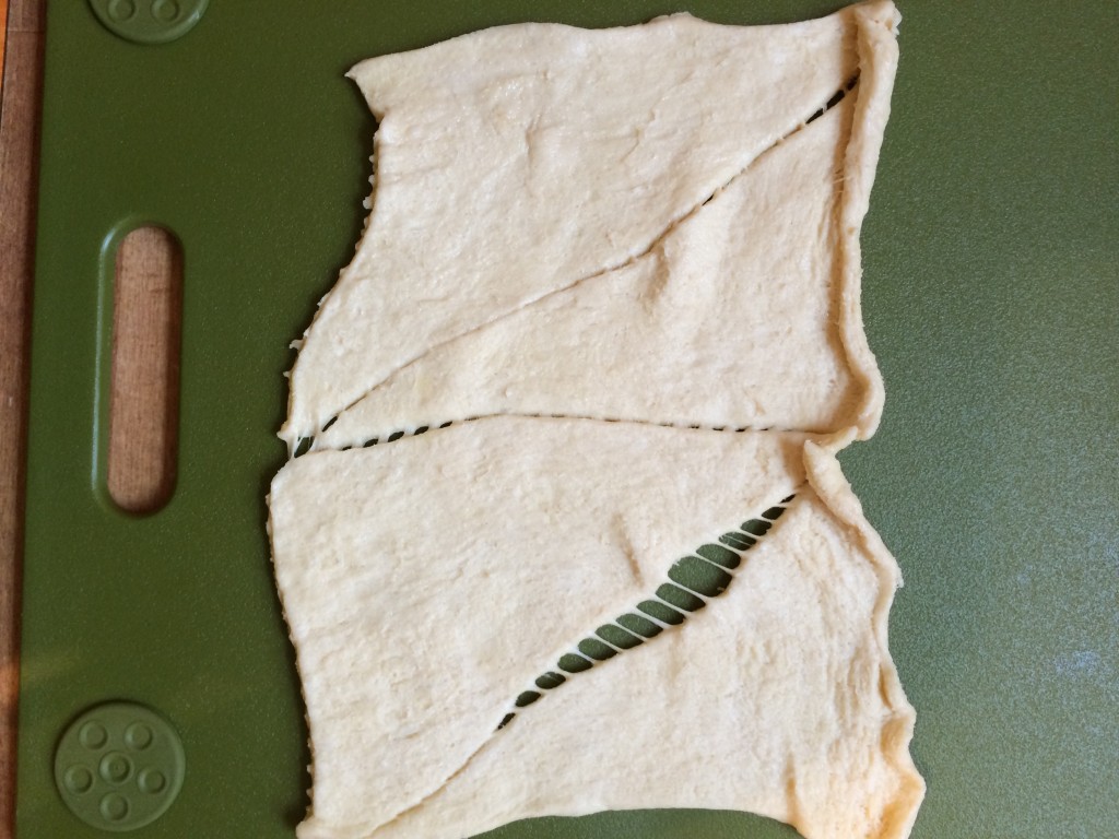 Take your crescent roll and pinch together the perforation to make one sheet 