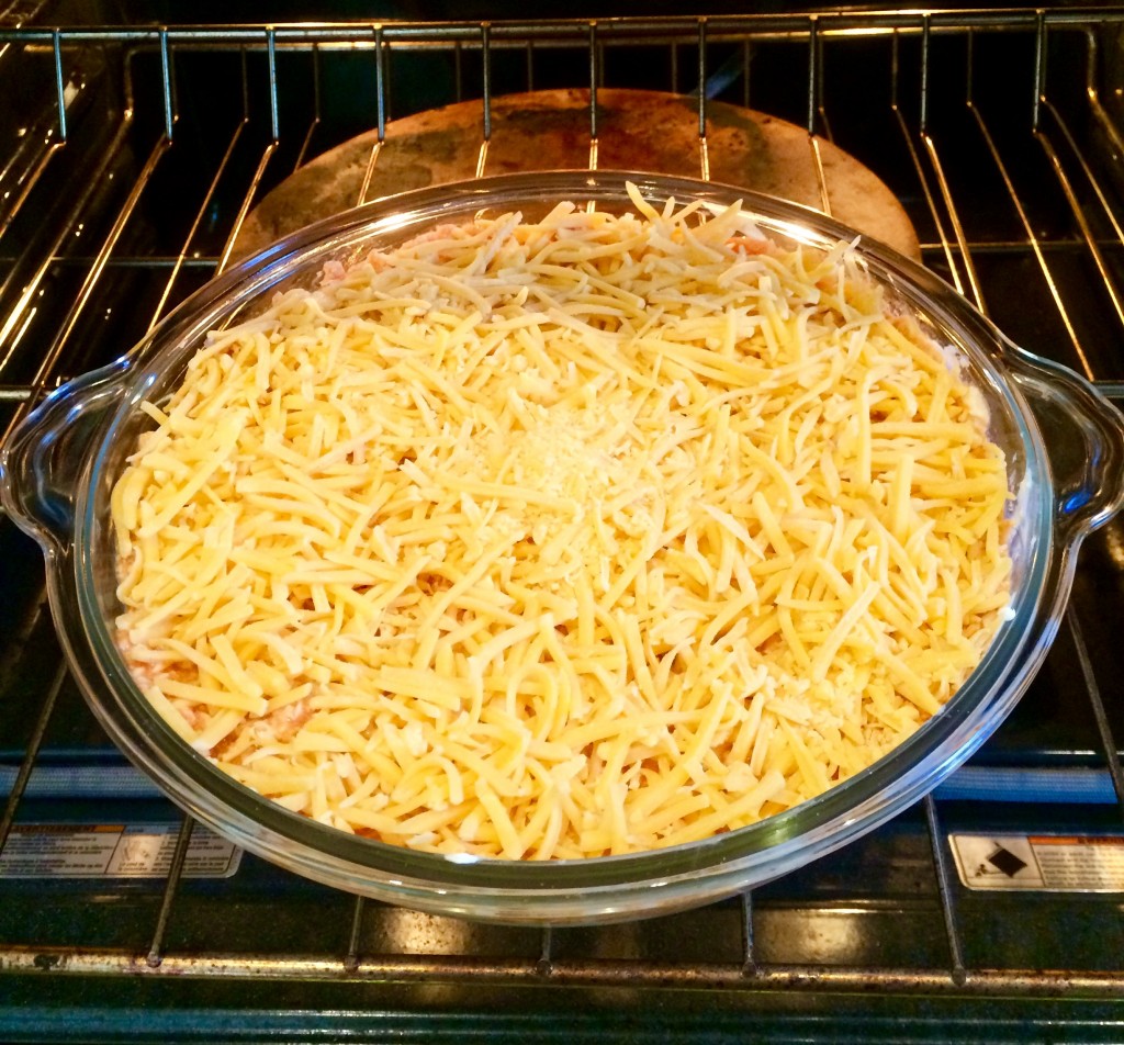 Topped with cheddar cheese and ready to go in the oven!